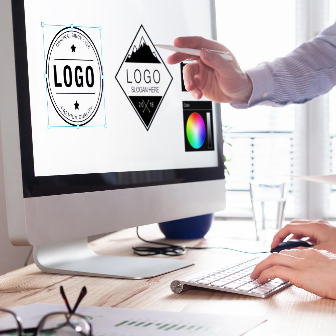Photo of someone creating logos on a computer