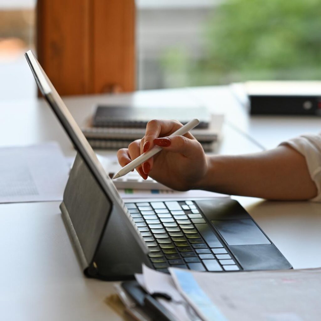 Photo of a website designer at a laptop completing a website audit.